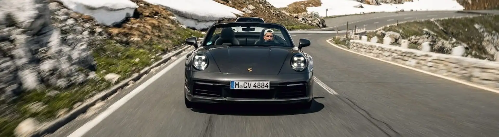 One of our Porsche 911s comes towards us on a mountain pass.